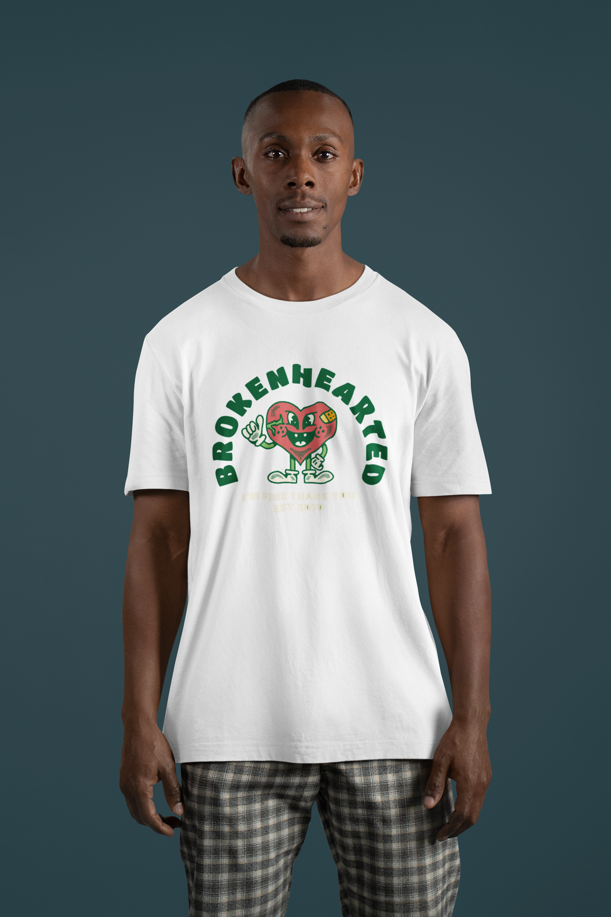 'Brokenhearted But Keeps On Rocking' t-shirt in white, man wearing it studio shot, funny music gift