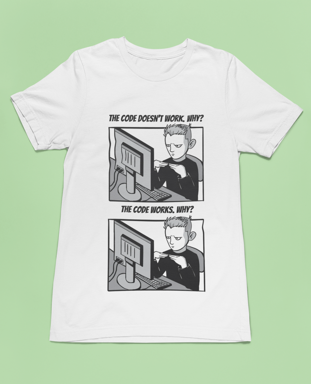 'The Code Doesn't Work, Why?' t-shirt in white, flat lay on a light green background, funny developer gift