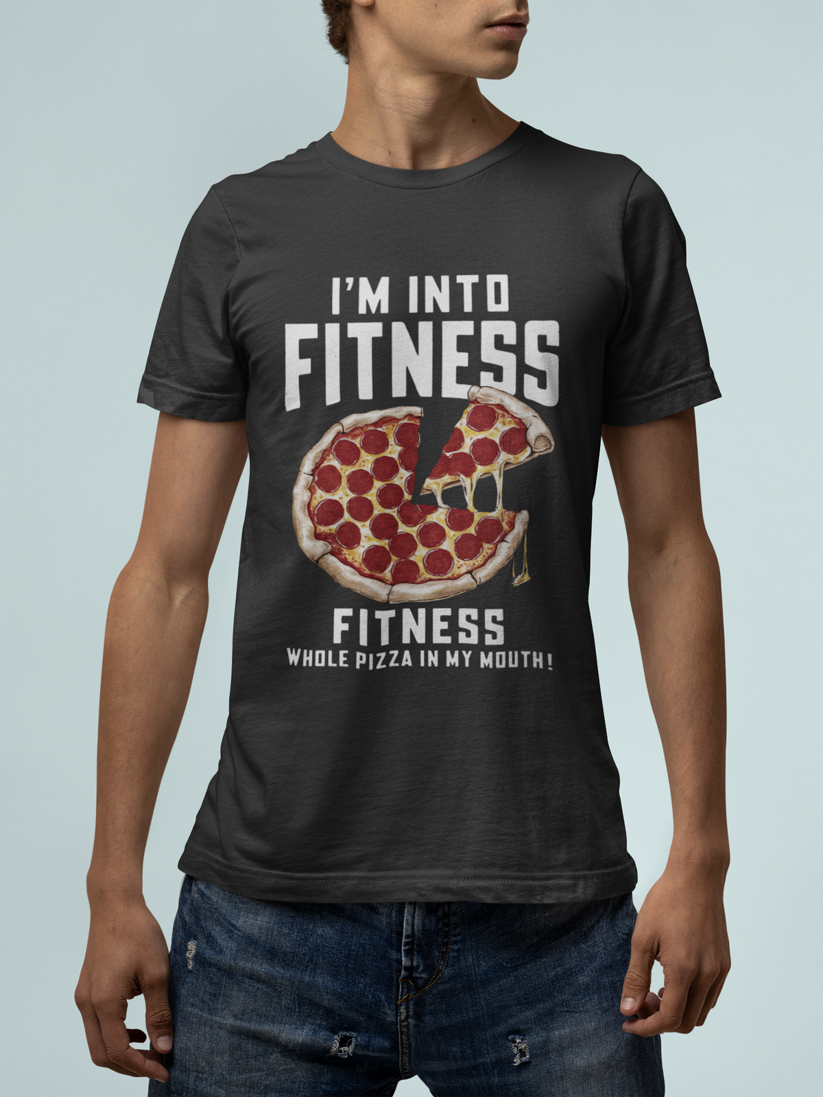 'I'm Into Fitness' pizza slice t-shirt in heather gray, man wearing it in a studio shoot, funny gym gift for him