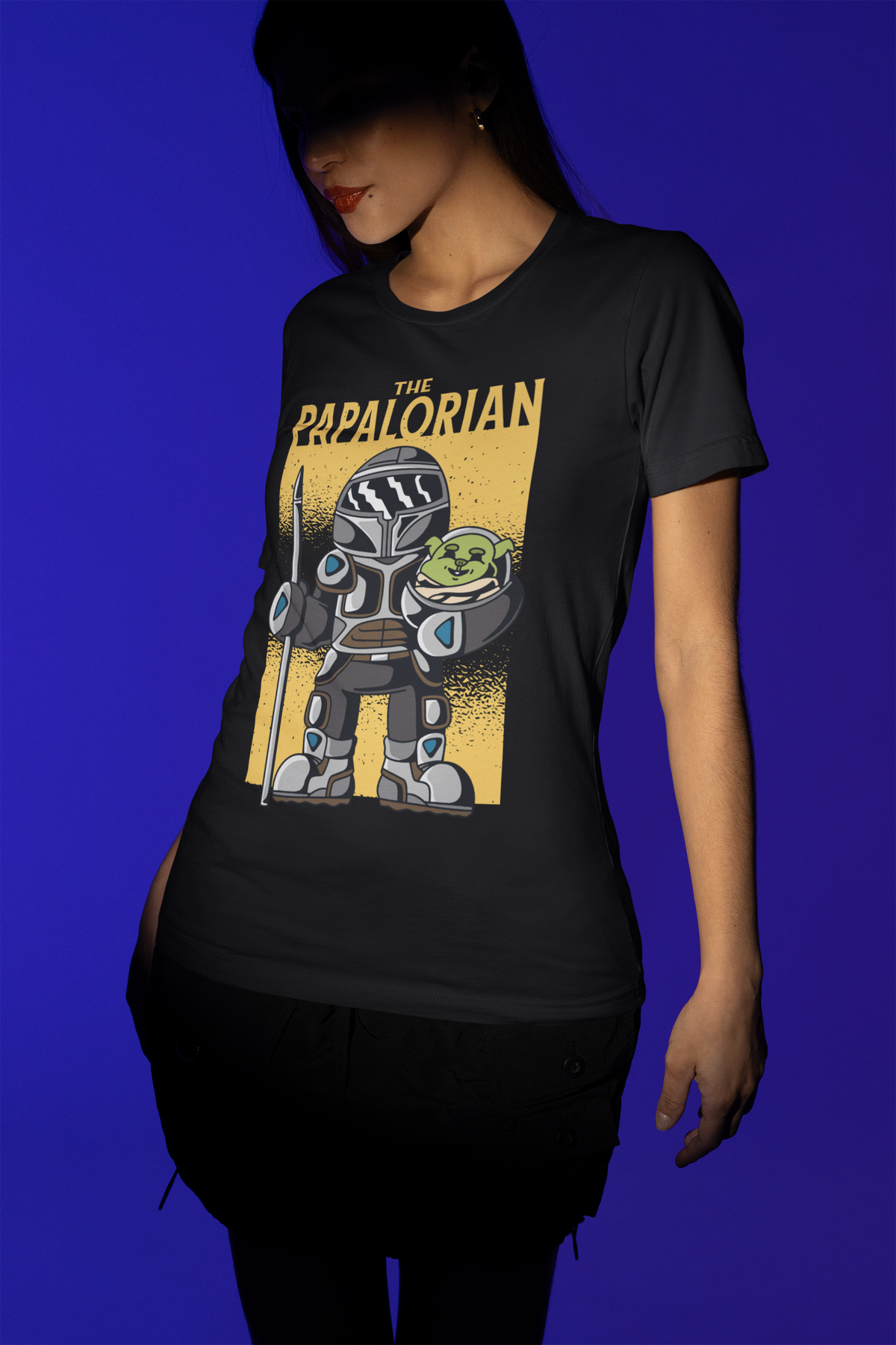 'The Papalorian' t-shirt in black, woman model wearing it against a blue background