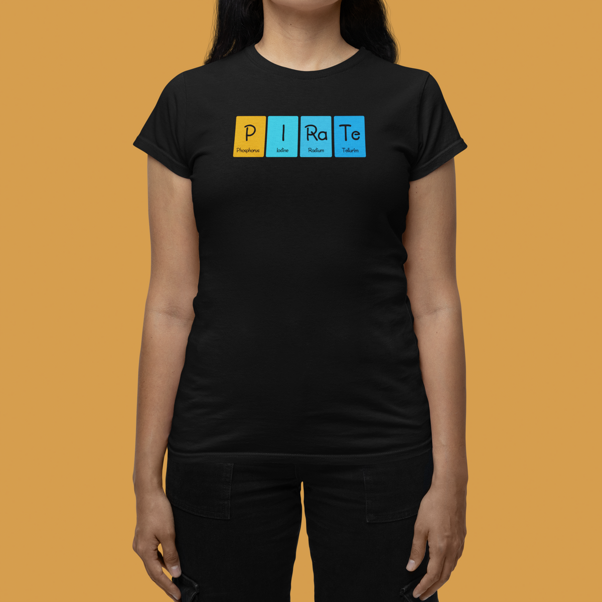 'P-I-Ra-Te' periodic table women's tee in black, woman modeling it on orange background, funny science gift
