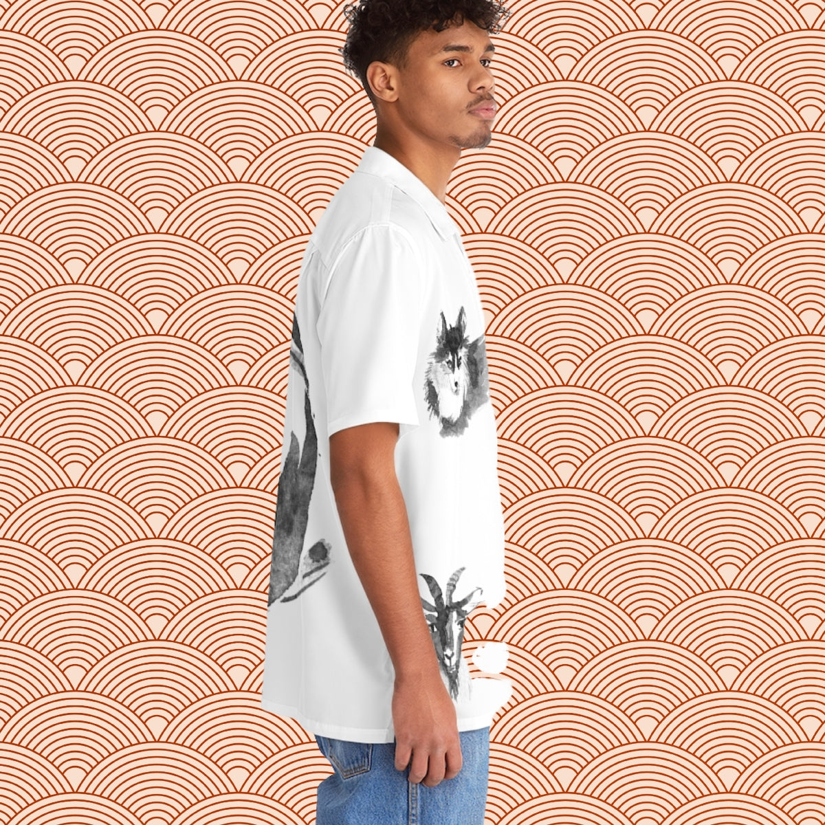 A man is standing in front of the last Oron's Collection LTE - Spirit Animals T-Shirt, featuring an orange and white pattern.
