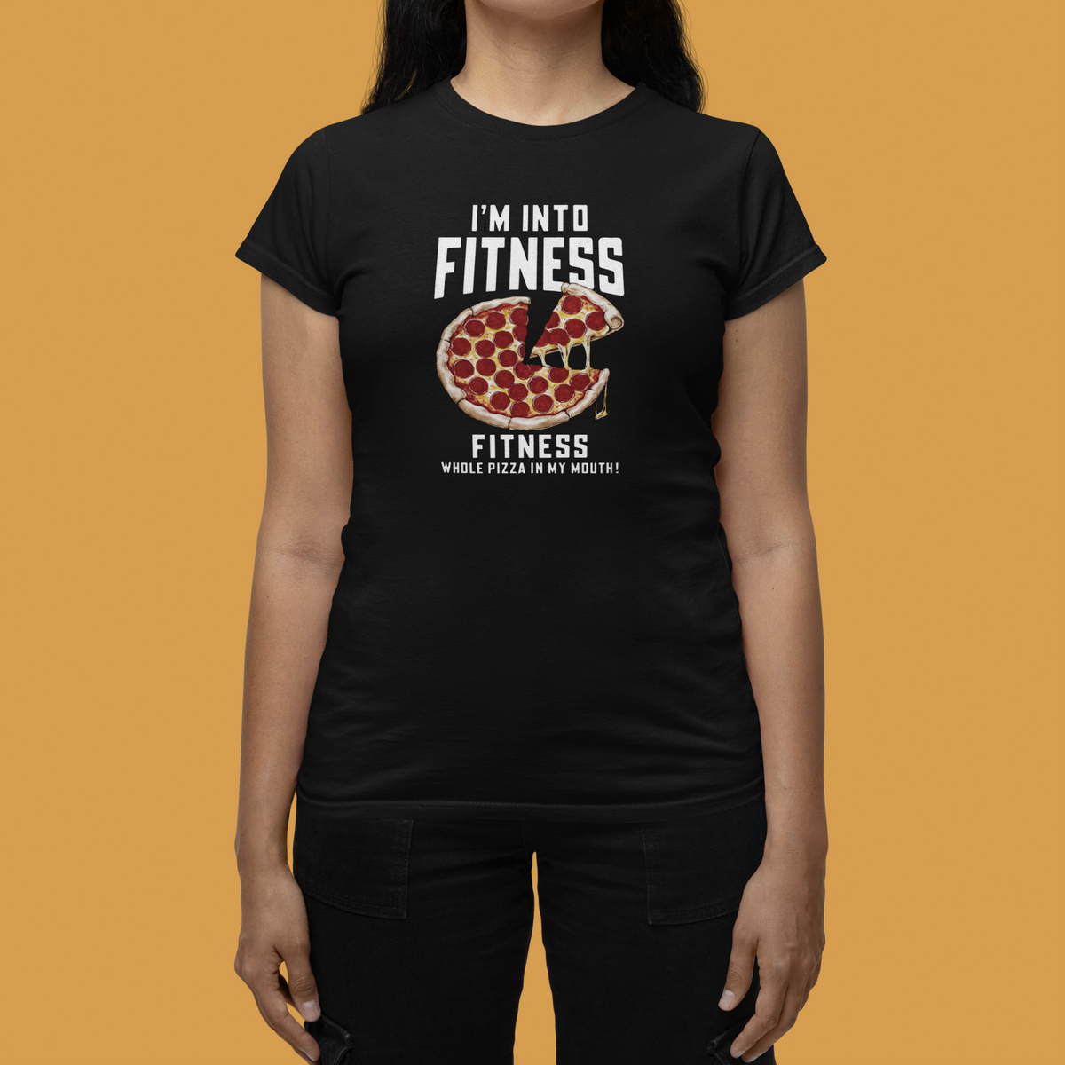 'I'm Into Fitness' pizza slice women's t-shirt in black, close-up of woman wearing it, funny gym humor tee for her