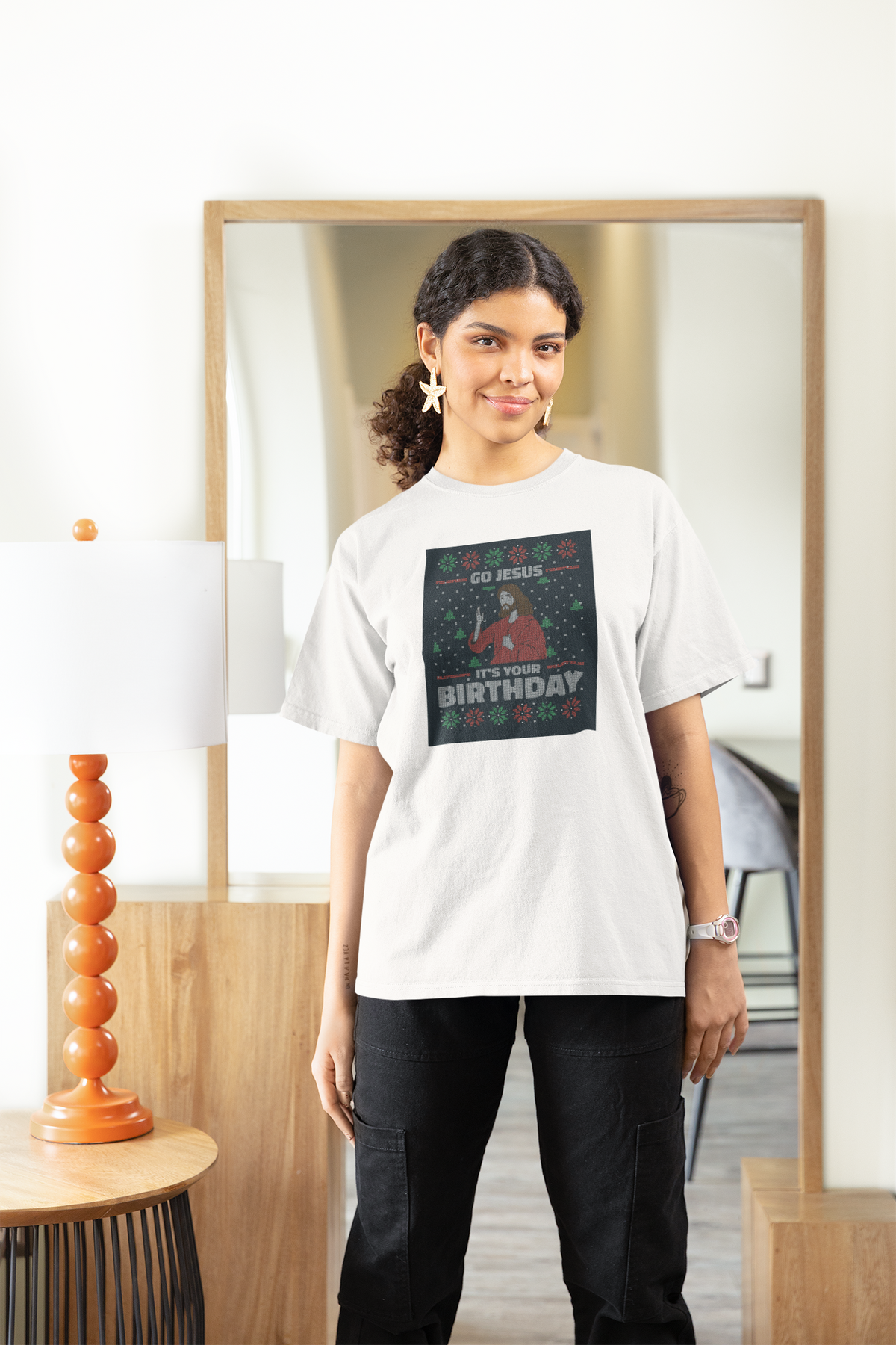 'Go Jesus It's Your Birthday' Women's T-Shirt in white, woman wearing it indoors, funny holiday gift