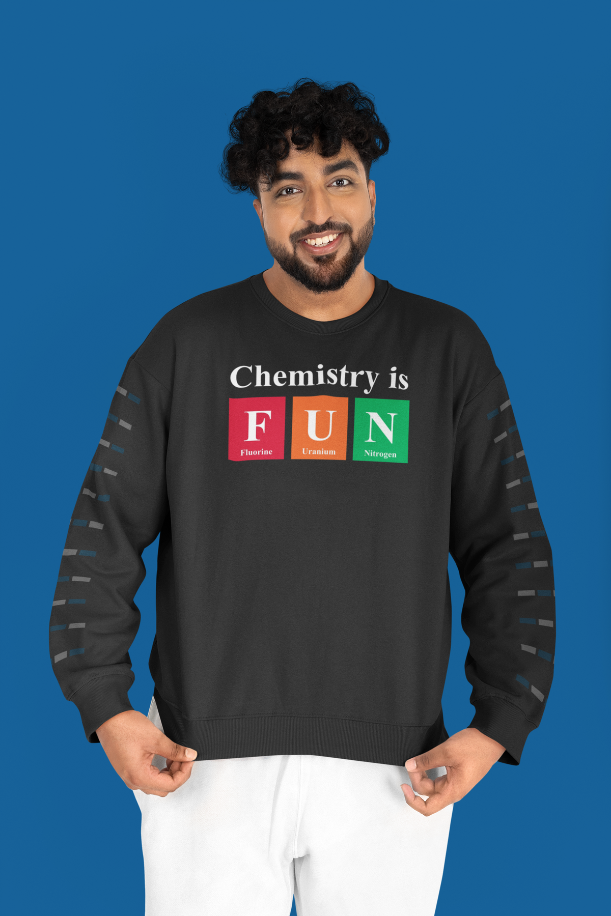 'Chemistry is FUN' crewneck sweatshirt in black, man wearing it against blue studio backdrop, funny chemistry pun gift