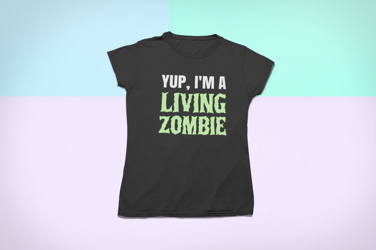 'Yup, I'm a Living Zombie' t-shirt in black, styled flat lay on pastel backdrop, funny zombie shirt gift