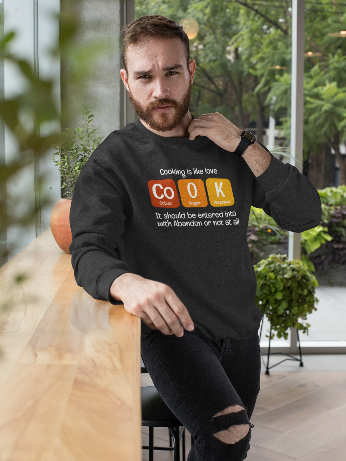 Co-O-K periodic table cook element pun crewneck sweatshirt, flat lay with the graphic centered