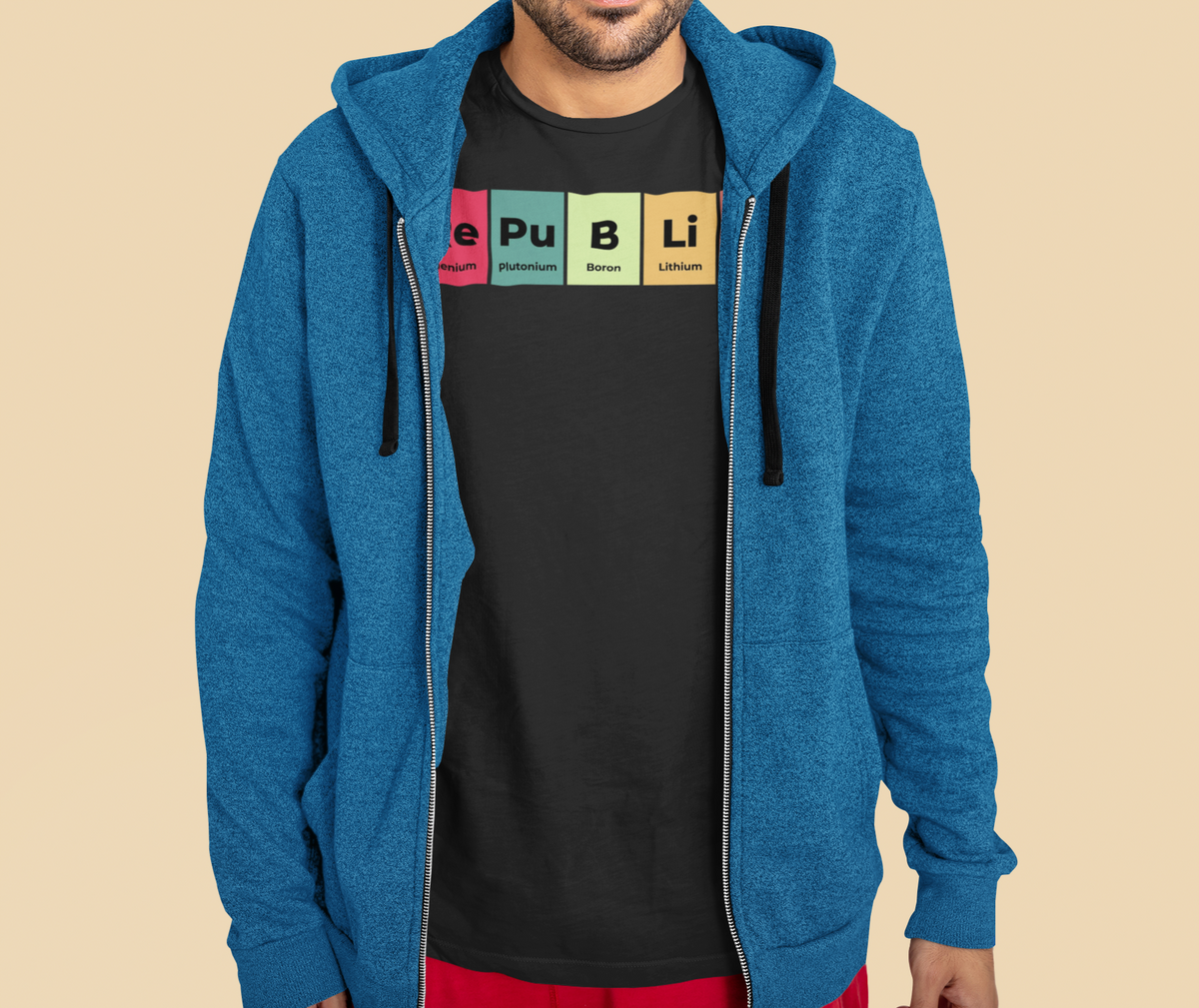 'Republic' periodic table t-shirt in black, man wearing it under a blue zip hoodie, layered outfit photo