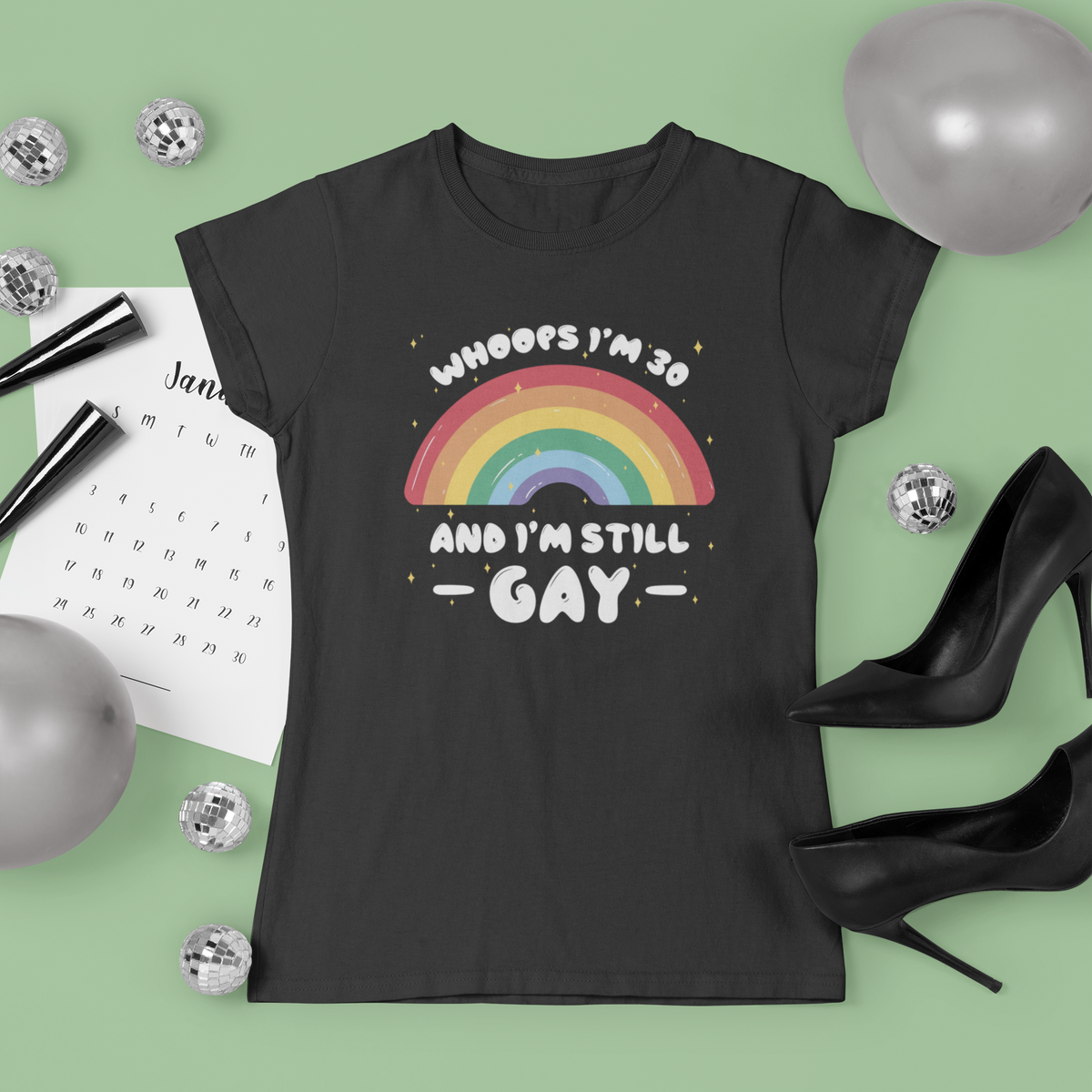 'Whoops I'm 30 and I'm Still Gay' T-shirt in black, flat lay with festive props, funny pride birthday shirt