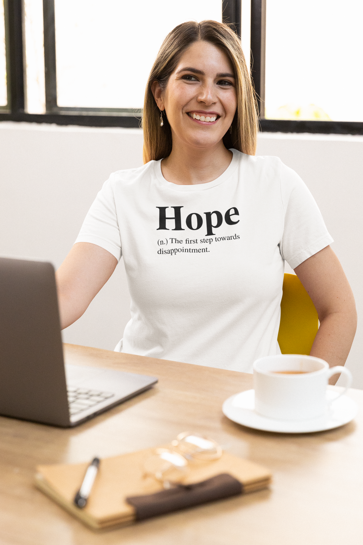 'Hope T-Shirt' in white, woman at an office desk, T-Shirt mockup, Geekpsters
