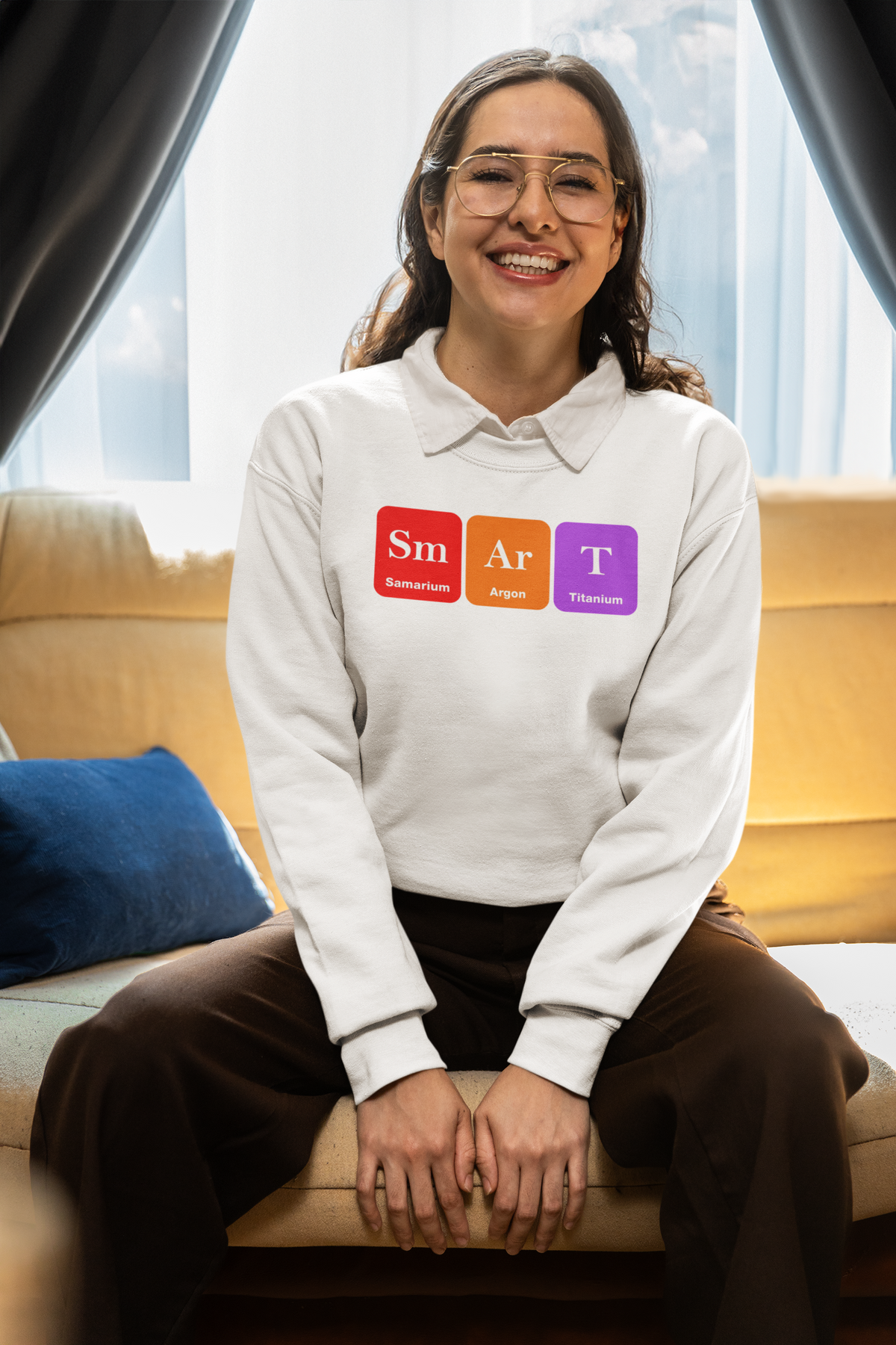 'Smart' periodic table sweatshirt in cream, woman wearing it seated indoors, funny science pun gift
