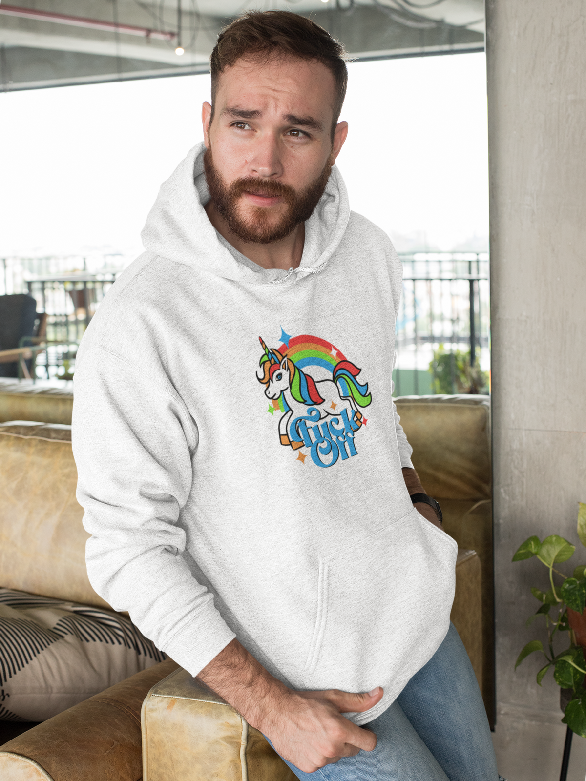 F Off Hoodie in heather gray, bearded man wearing it indoors, funny unicorn graphic hoodie