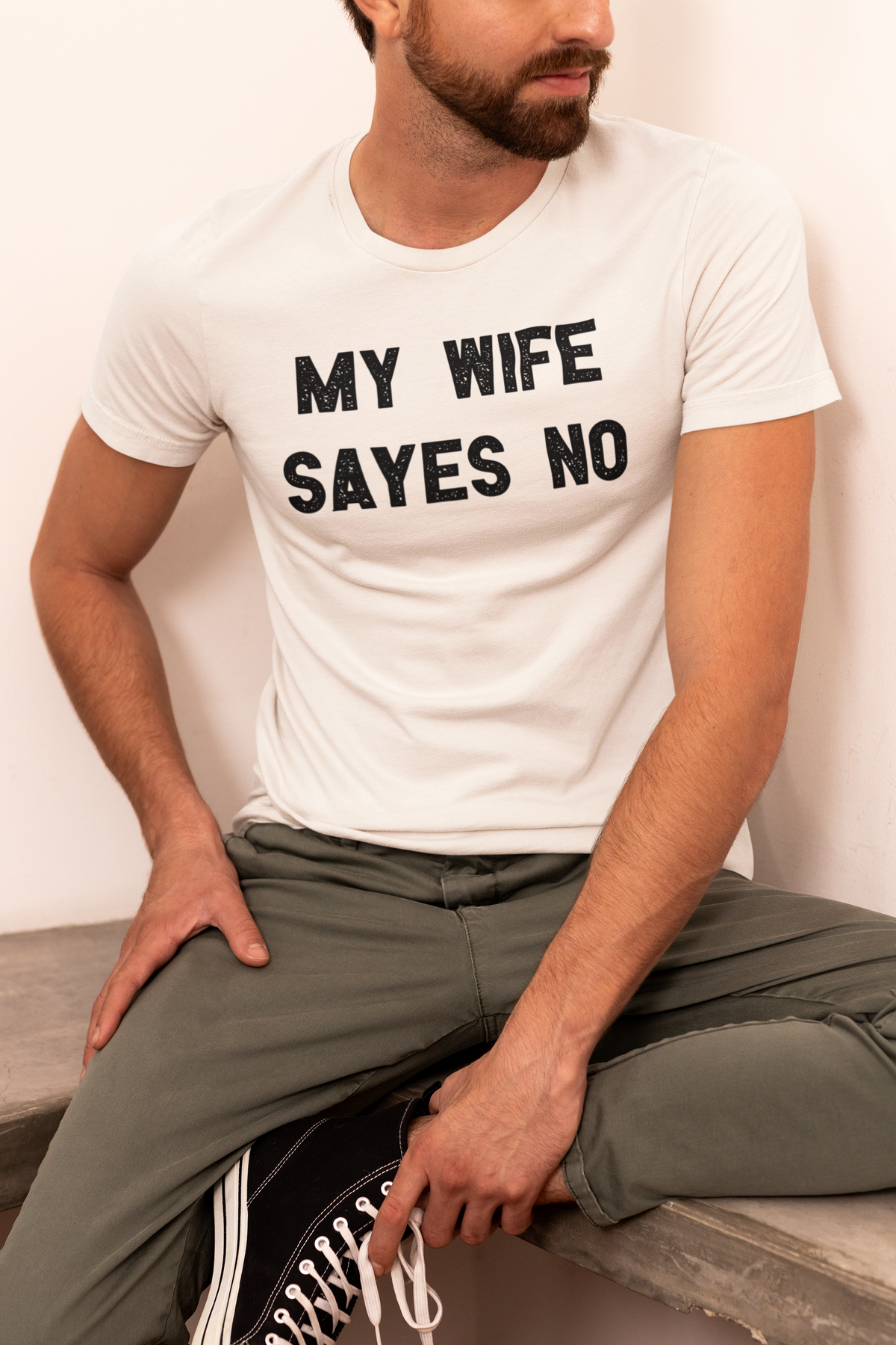 'My Wife Sayes No' t-shirt in cream, man wearing it seated, funny sarcastic shirt gift idea