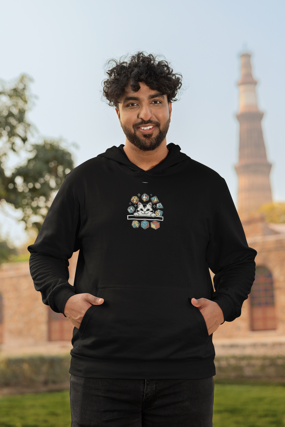'Cat Dice' in black, man by a historic building, Hoodie mockup, Geekpsters