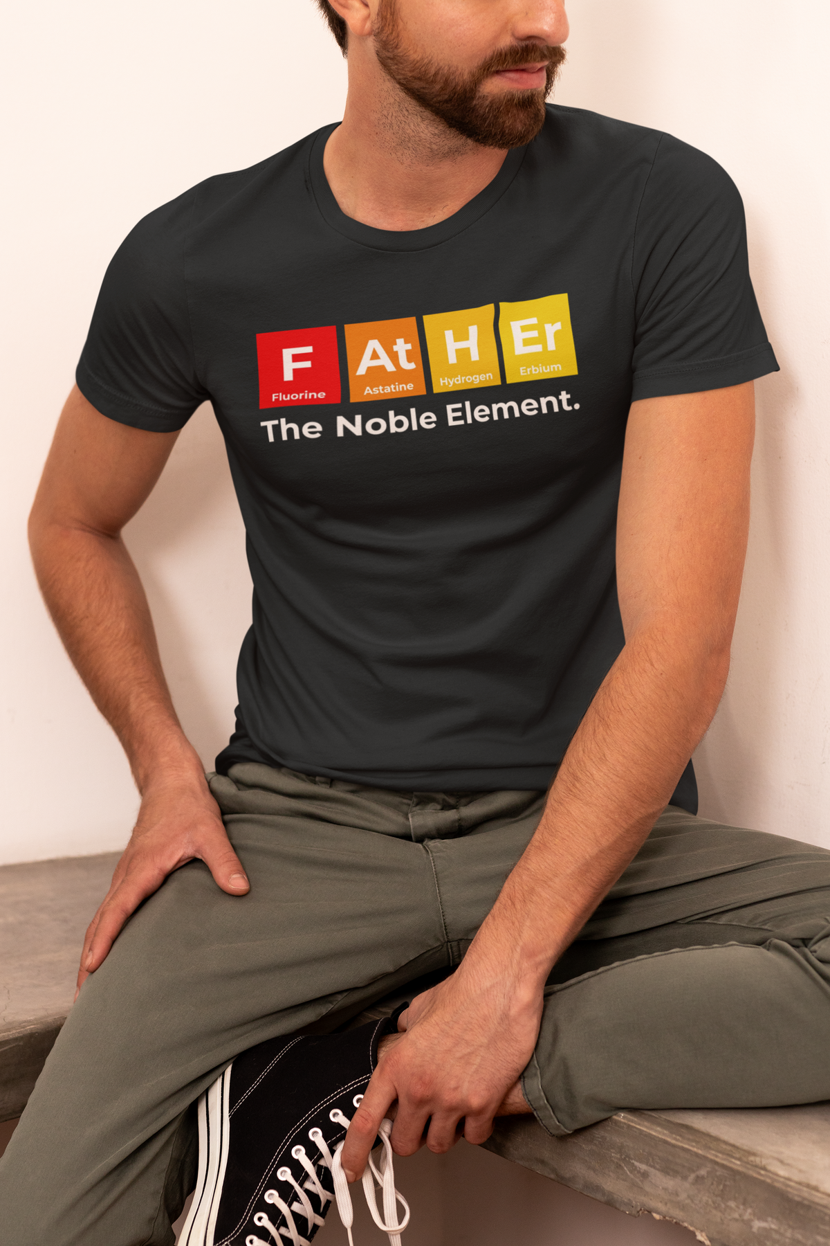 'Father: The Noble Element' t-shirt in charcoal heather, man wearing it, funny chemistry tee for dad
