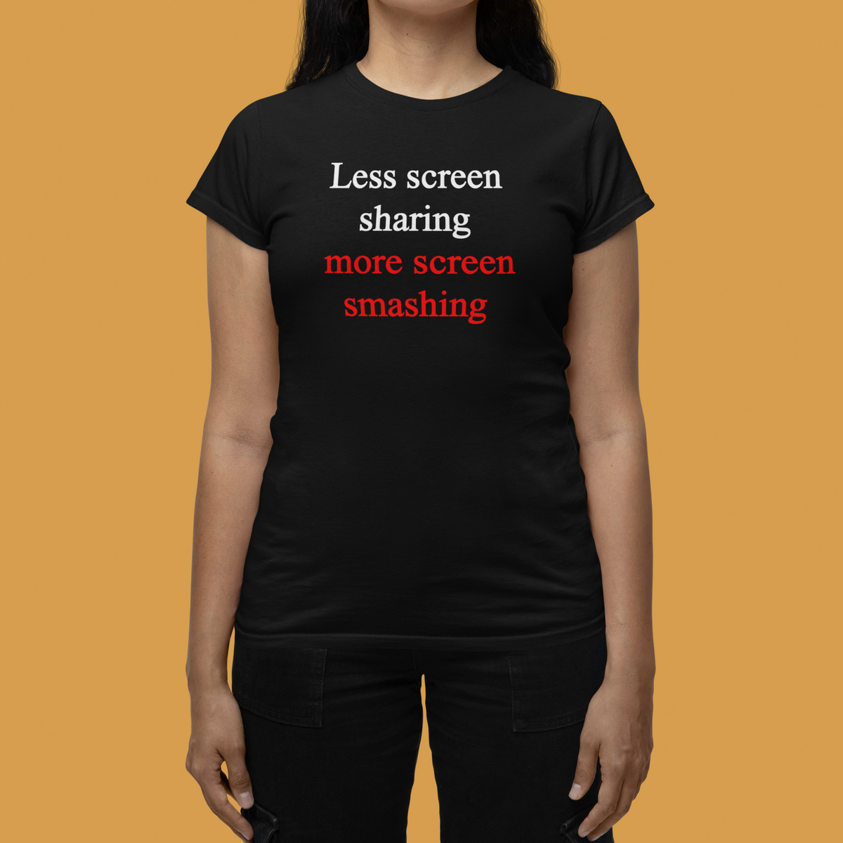 'Less screen sharing more screen smashing' womens tee in black, woman wearing it on mustard background, gamer gift