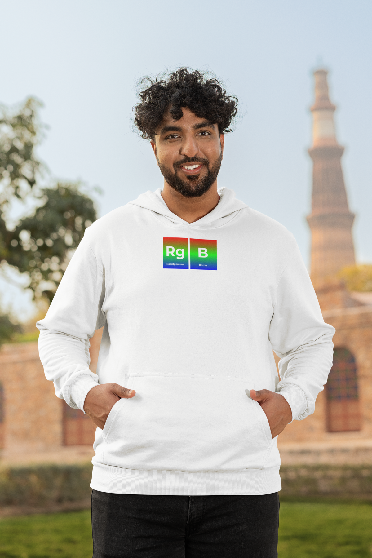'RG-B Periodic Table Hoodie' in white, man by a historic building, Hoodie mockup, Geekpsters