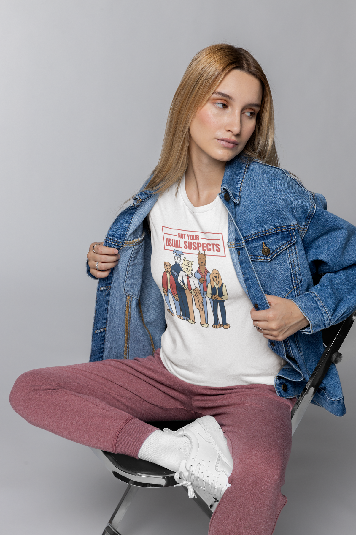 'Not Your Usual Suspects' T-shirt in white, woman wearing it with a denim jacket, movie fan gift shirt