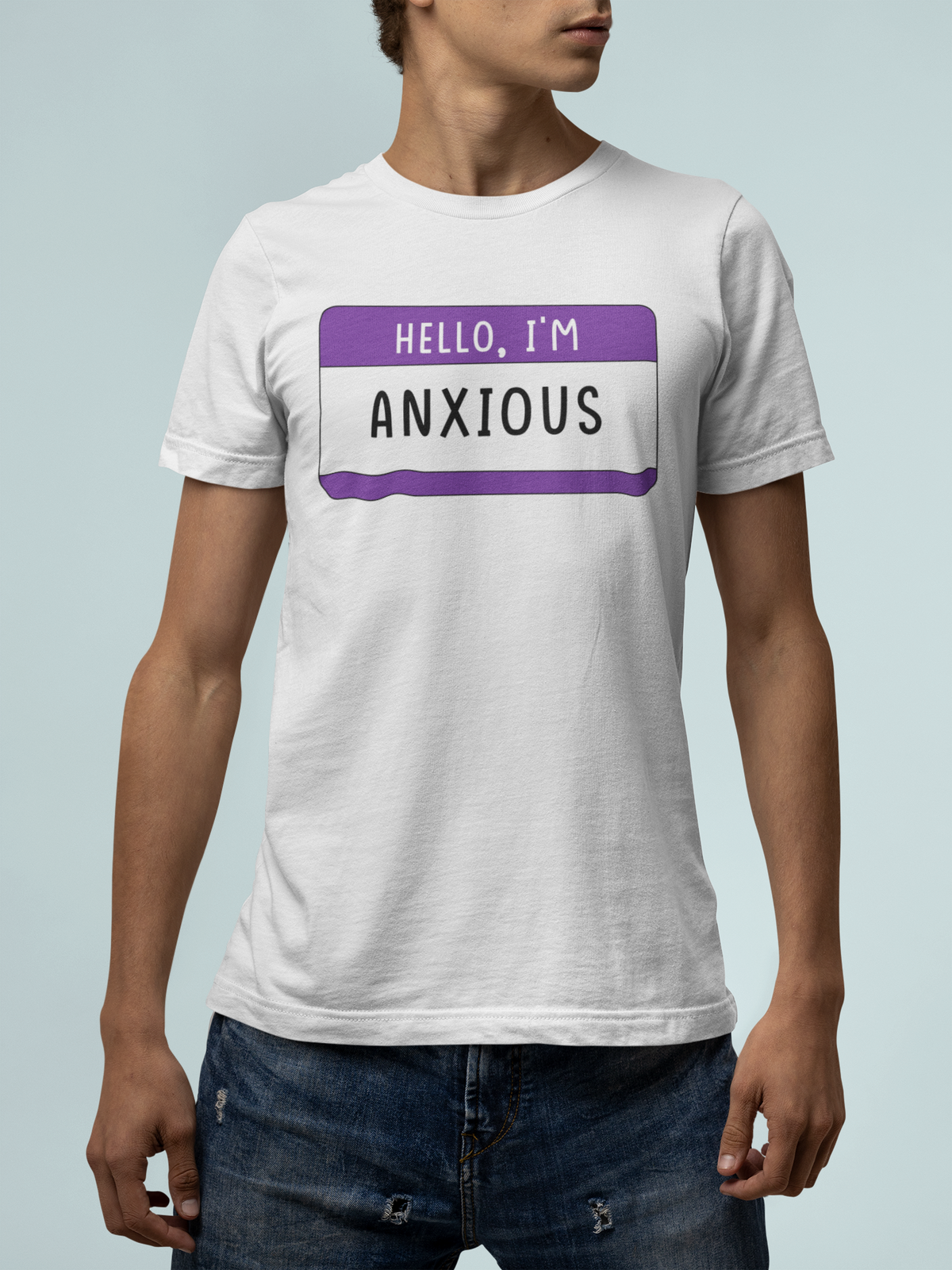 Hello I'm Anxious T-shirt in white, close-up front view worn by man, mental health gift tee