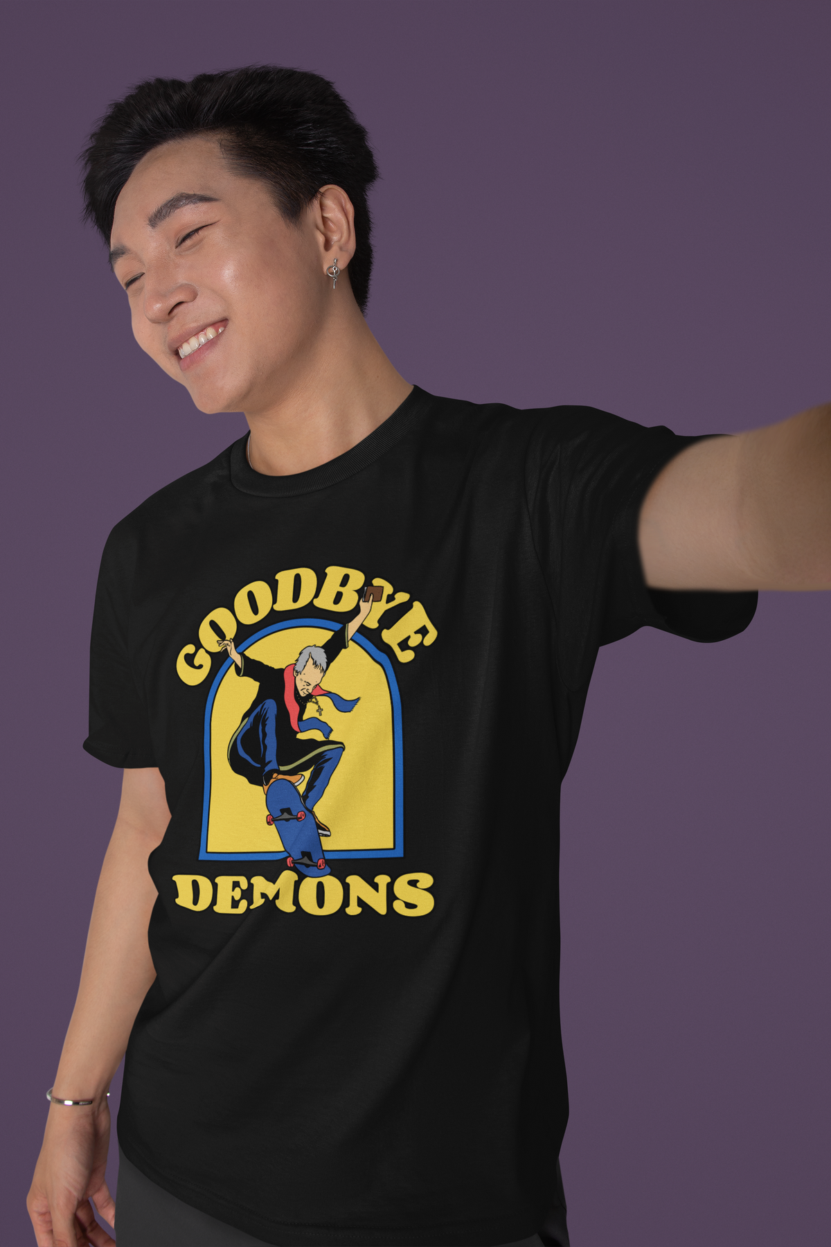 'Goodbye Demons' exorcist graphic t-shirt in black, man taking a selfie, funny quirky gift idea