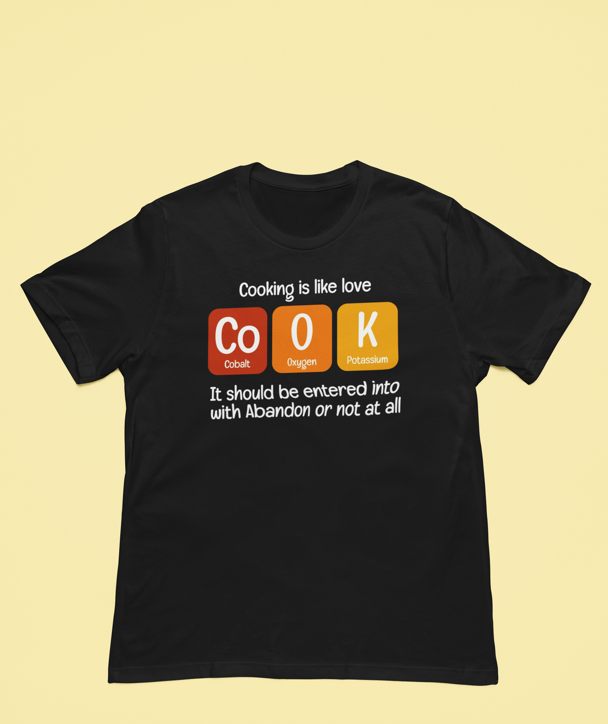'Cook' t-shirt in black, man wearing it against teal backdrop, funny kitchen pun gift