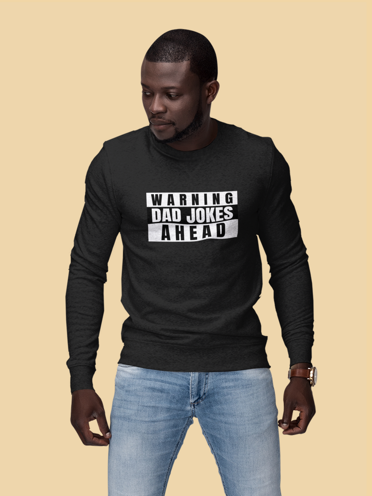 'Warning Dad Jokes Ahead' sweatshirt in black, man wearing it on tan backdrop, funny gift for dad