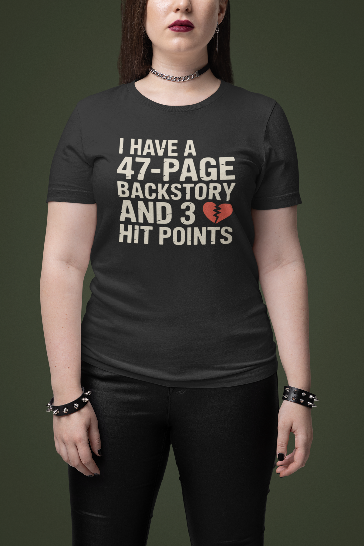 'I Have a 47-Page Backstory and 3 Hit Points' black tee worn by woman on green backdrop, RPG gift