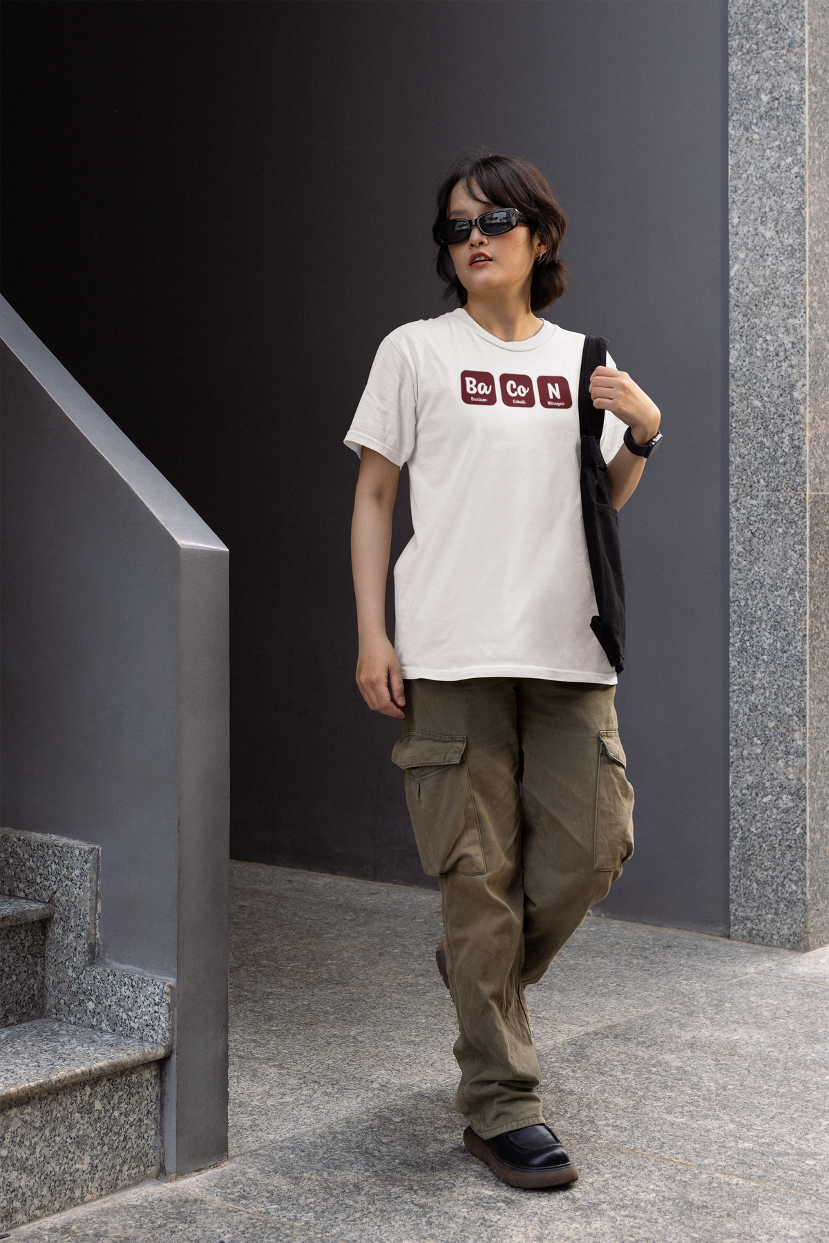 'Ba-Co-N' women's fitted t-shirt in white, person wearing it outdoors on stairs, funny bacon lover gift