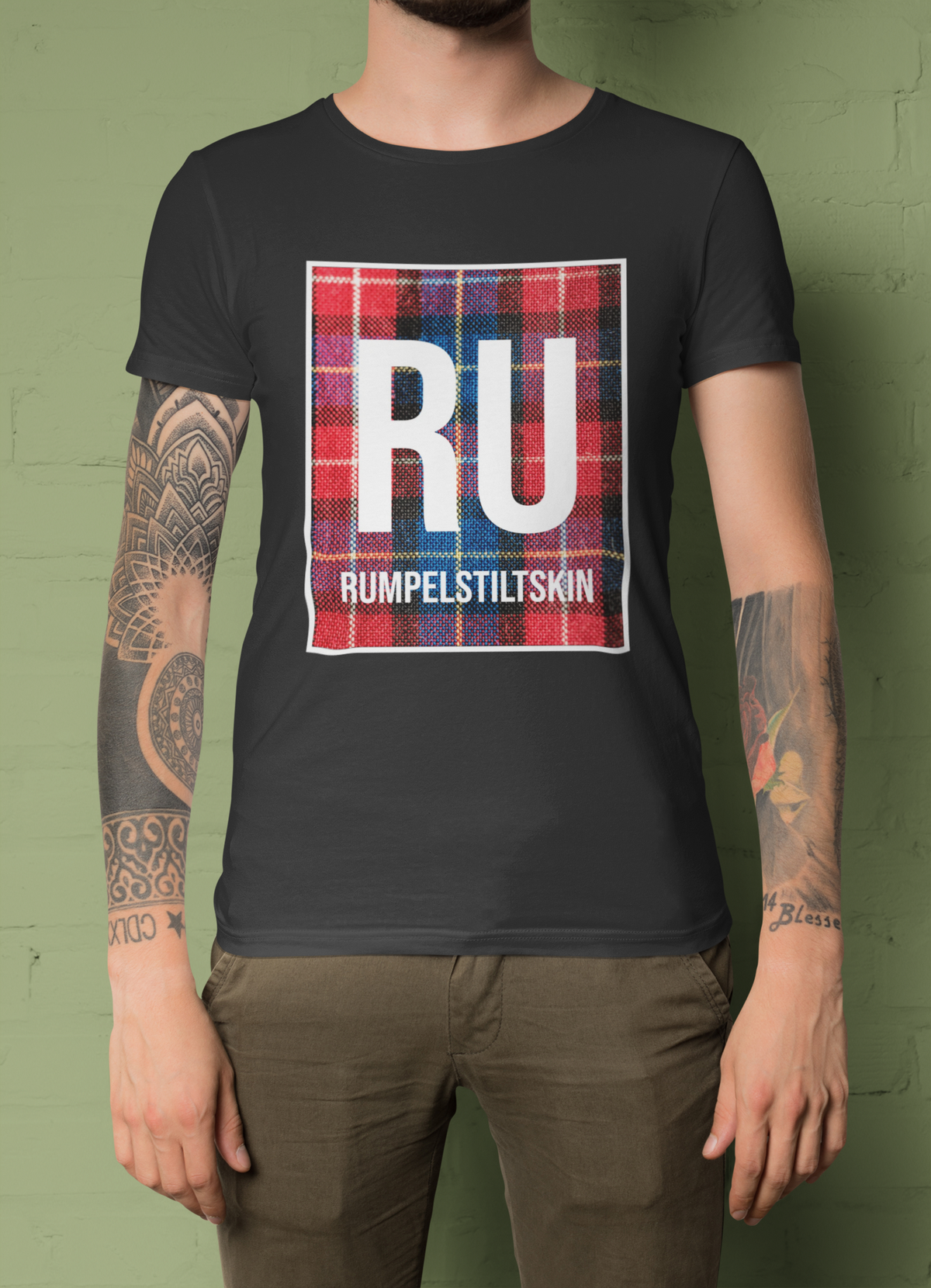 'RU Rumpelstiltskin' periodic table t-shirt in black, tattooed woman wearing it, funny fairytale pun tee
