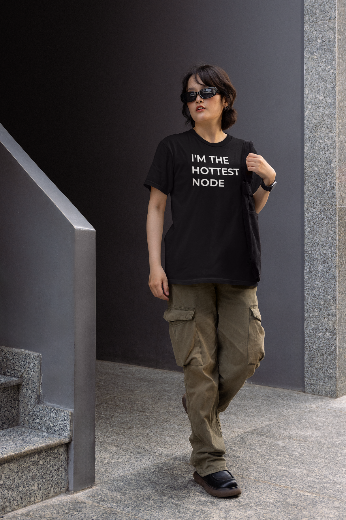 'I'm The Hottest Node' women's tee in black, man walking down stairs, funny programmer tee gift idea