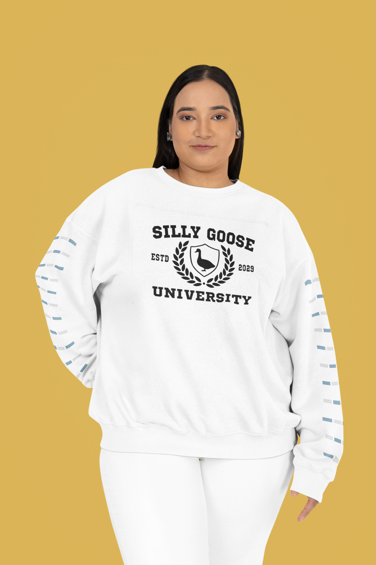 'Silly Goose University' crest Sweatshirt in white, curvy woman wearing it against mustard backdrop, funny gift