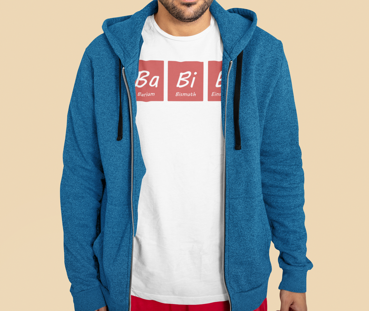 'Babies' periodic table T-shirt in white, man wearing it under a blue hoodie, science gift shirt