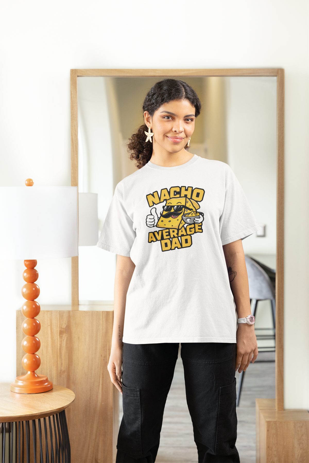 "Nacho Average Dad" women's tee in white, woman modeling it at home, funny Father's Day gift