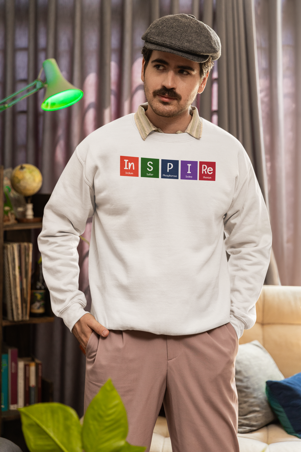 'InSPIRe' periodic table sweatshirt in heather oatmeal, man wearing it indoors, funny science pun gift