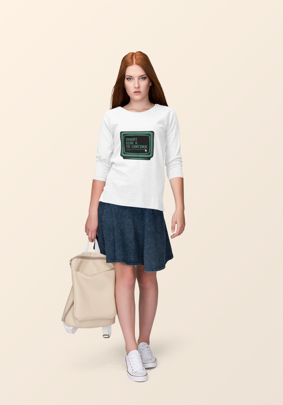 'Insert Disk A to Continue' sweatshirt in white, woman wearing it lifestyle outdoor, retro gamer gift