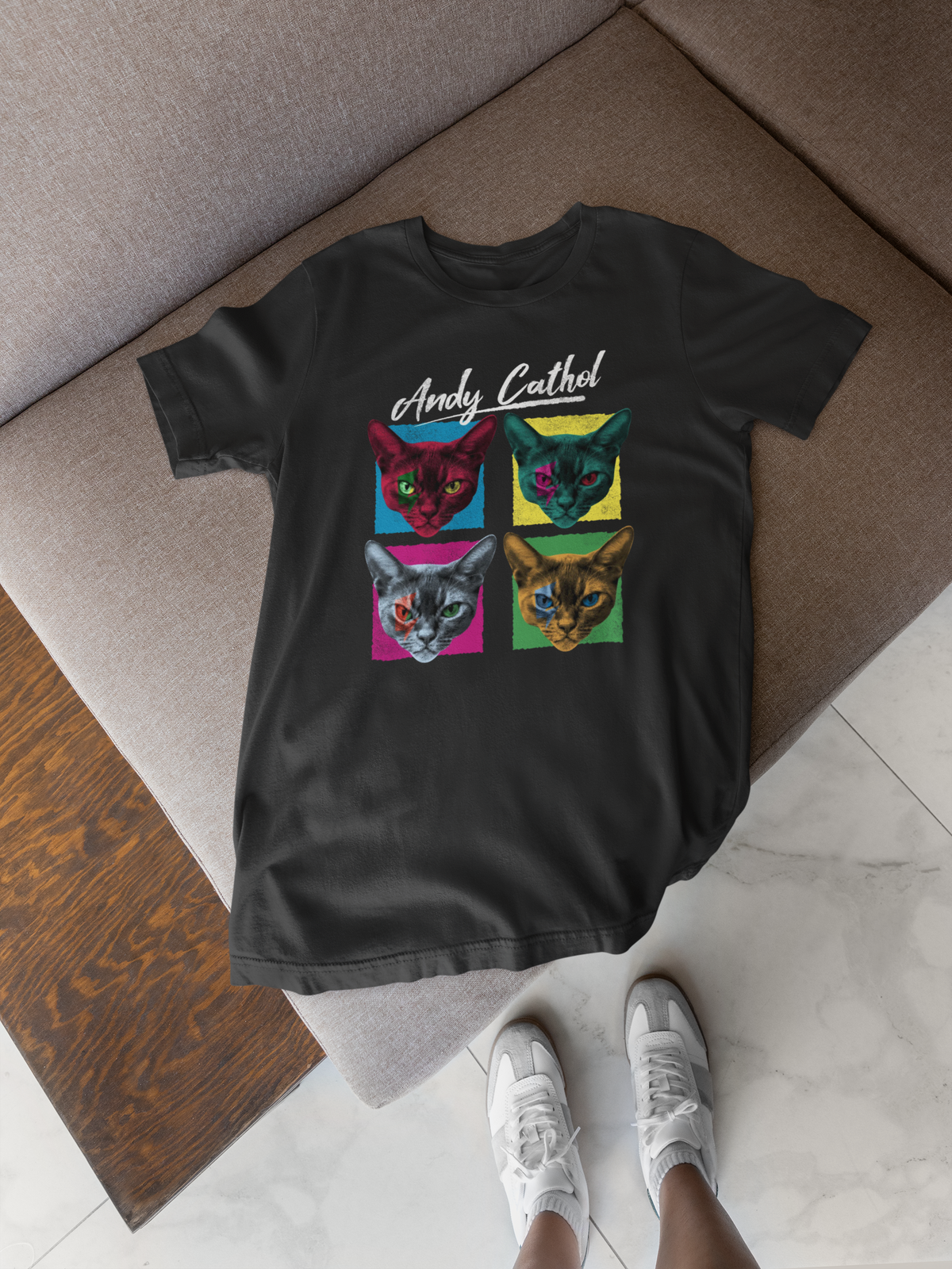 'Andy Cathol' pop art t-shirt in black, flat lay on wood floor, funny gift for cat lovers
