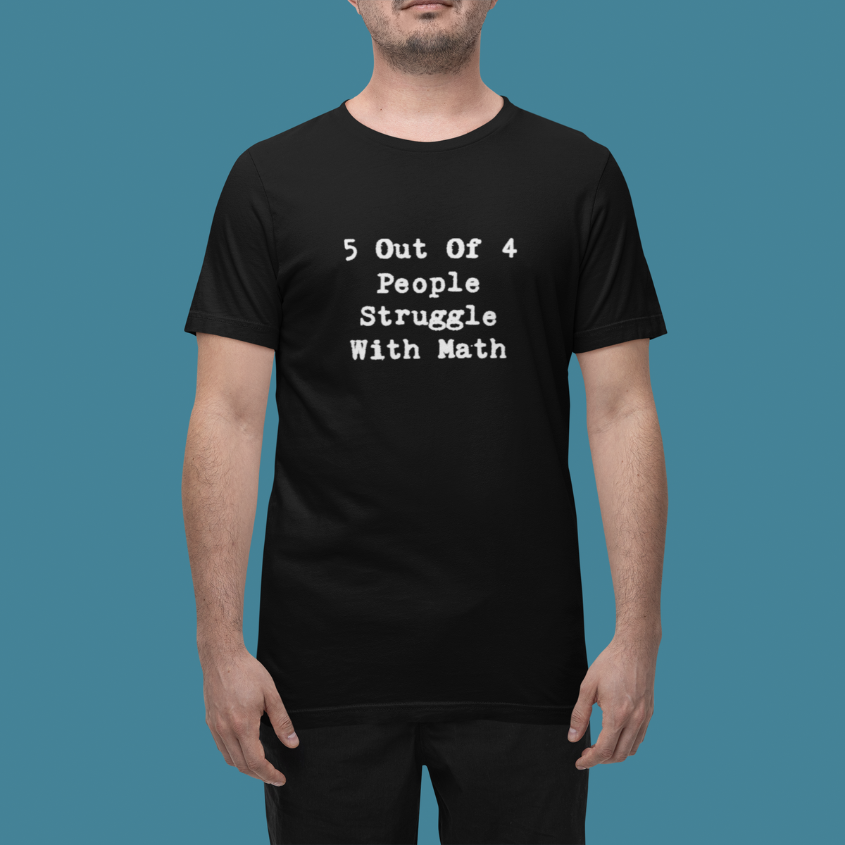 'Math Struggle For 5 Out Of 4 People T-Shirt' in black, man in a studio, T-Shirt mockup, Geekpsters