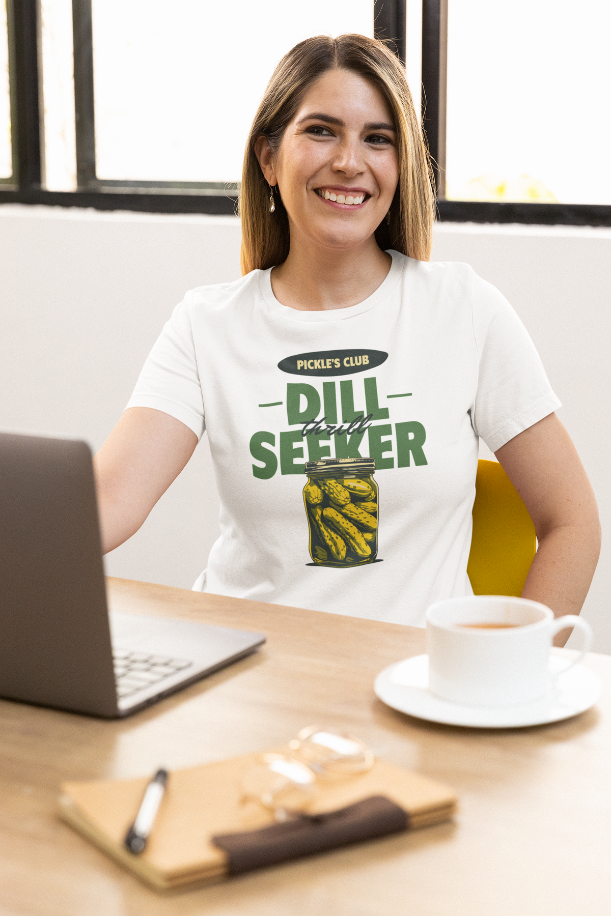 'Dill Seeker' pickle jar pun t-shirt in white, woman working at a desk with coffee, funny foodie gift