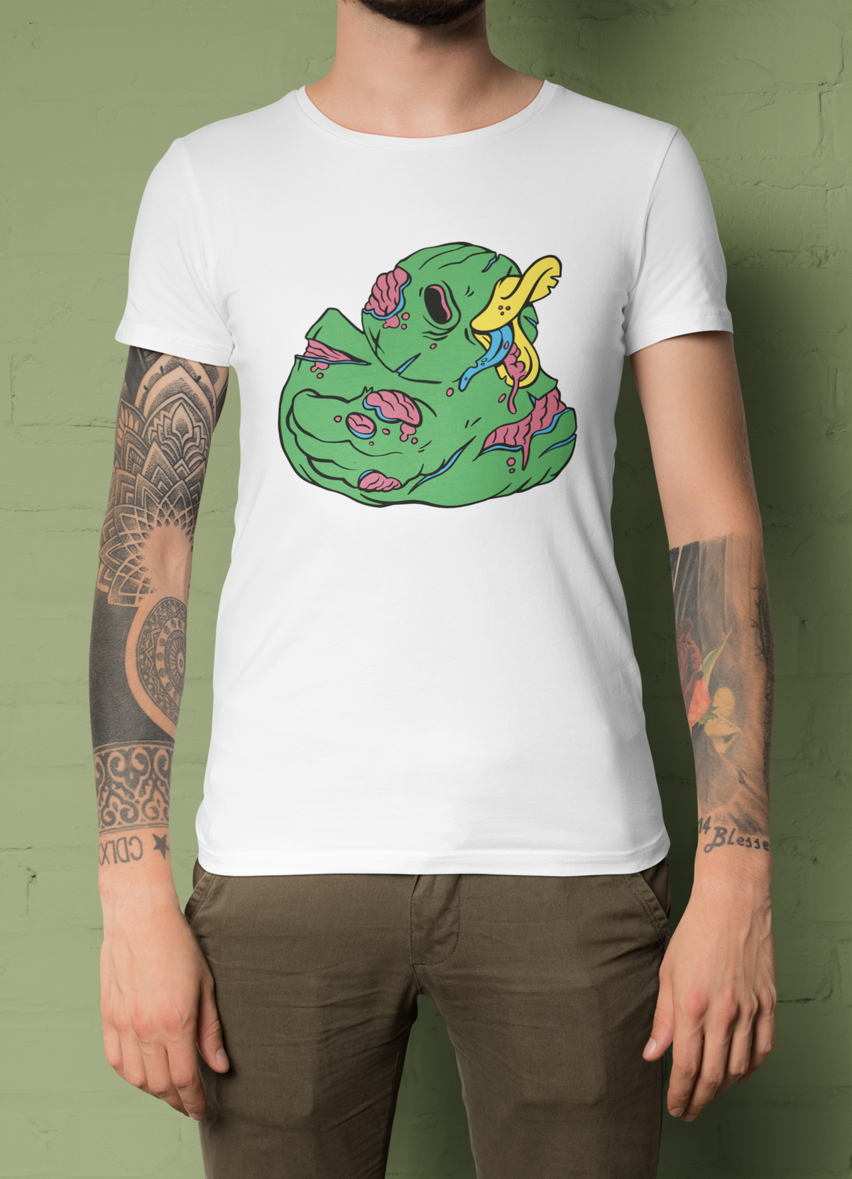Zombie duck t-shirt in white, tattooed man model wearing it against a dark green background, funny halloween gift