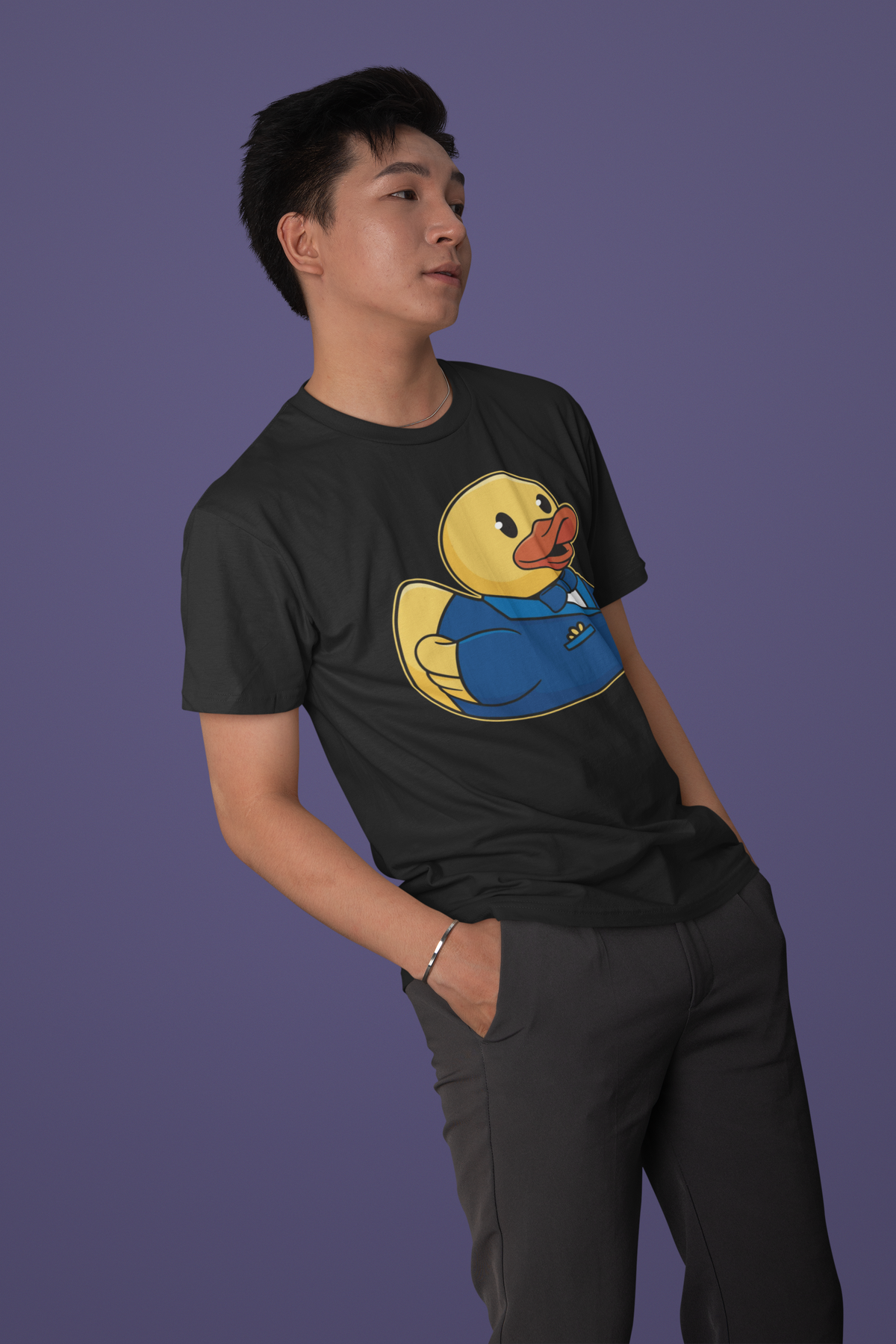 Groom duck t-shirt in black, man model wearing it against a purple background, funny bachelor gift shirt