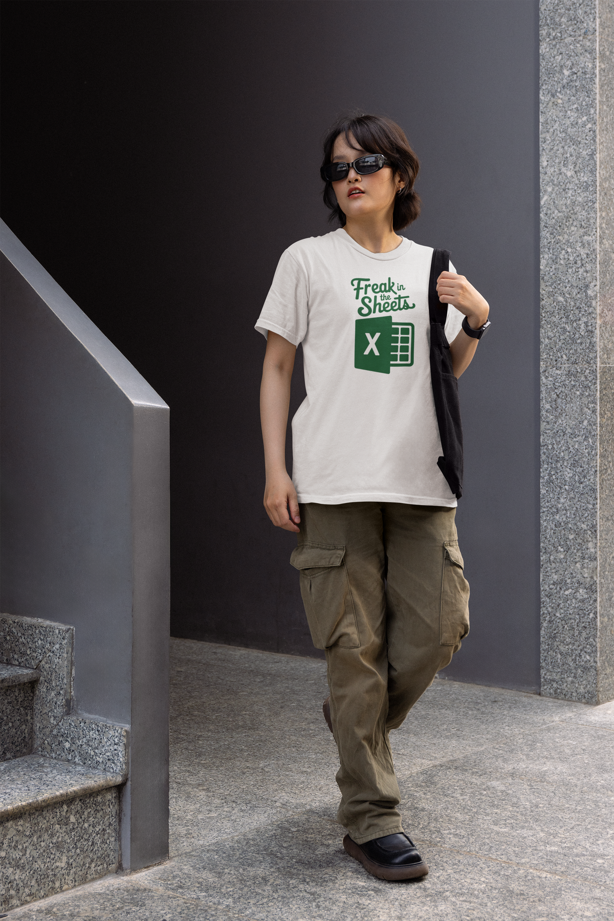 'Freak In The Sheets' womens tee in white, man walking outdoors wearing it, funny spreadsheet humor gift