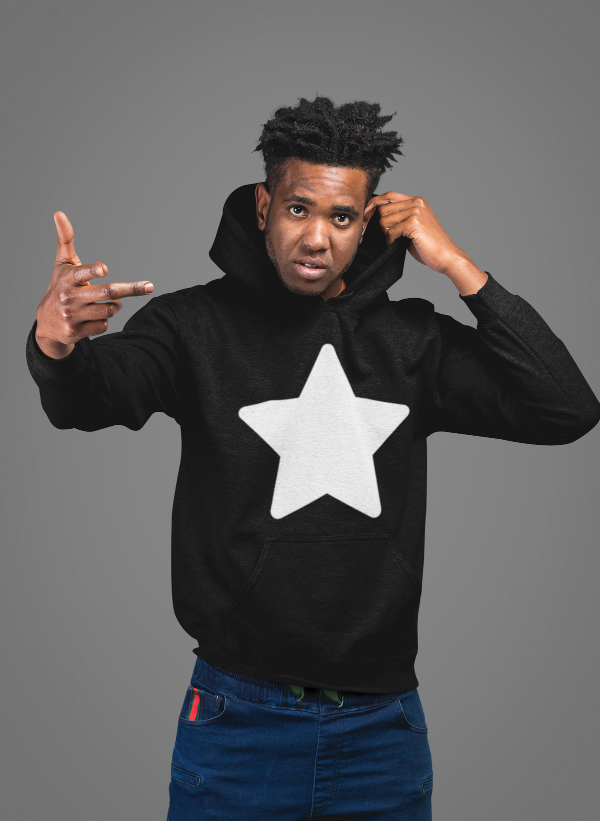 'Noga Star' hoodie in black, man wearing it in a studio, Hoodie mockup, Geekpsters