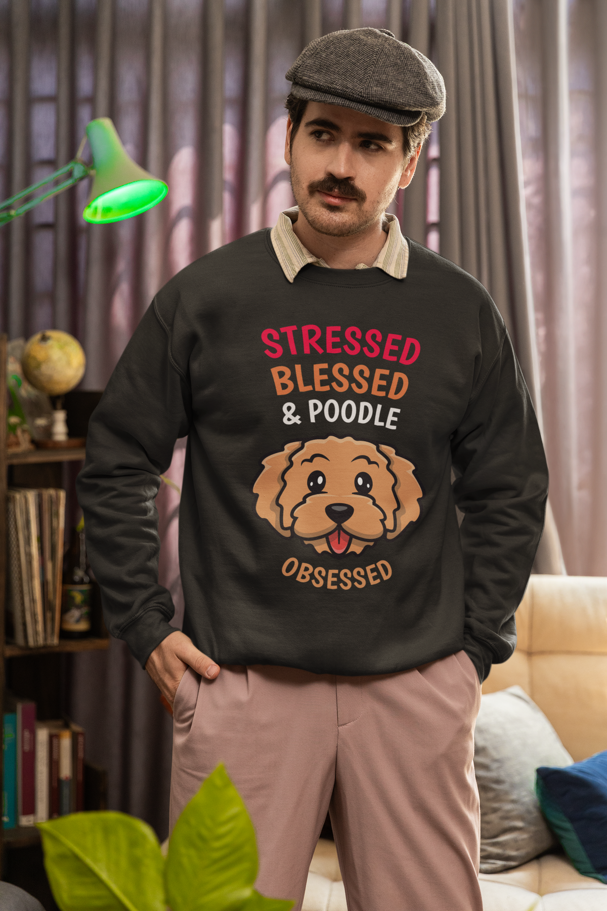 'Stressed Blessed & Poodle Obsessed' sweatshirt in heather black, man wearing a flat cap, dog lover gift