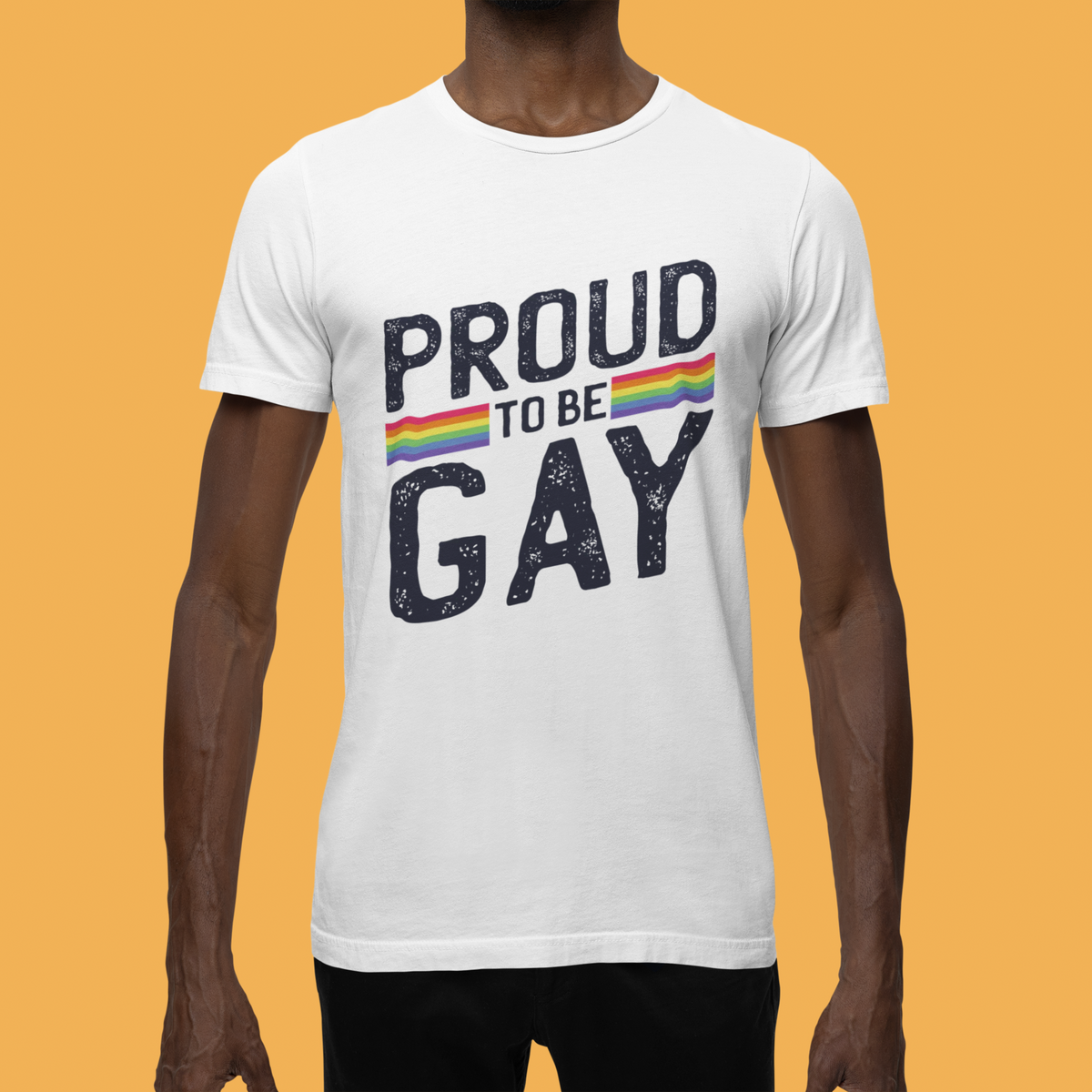 'Proud to Be Gay' T-shirt in white, man wearing it against a yellow backdrop, gay pride gift shirt