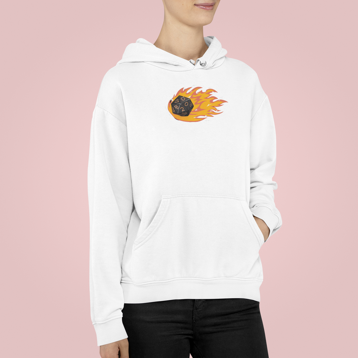 "Polyhedral Dice On Fire" hoodie in white, woman wearing it on pink backdrop, funny gamer gift