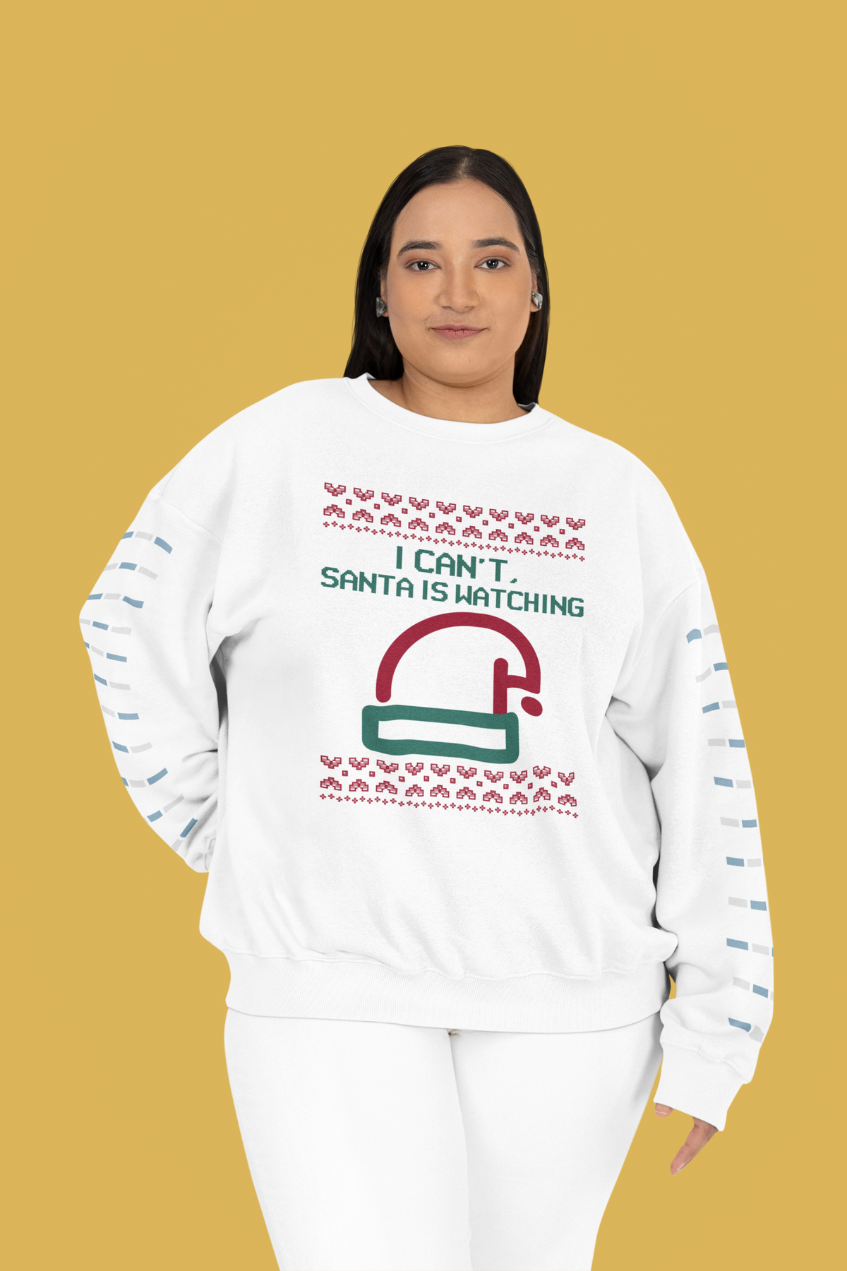 'I Can't Santa Is Watching' camera graphic sweatshirt in white, woman wearing it on yellow backdrop, funny Christmas gift