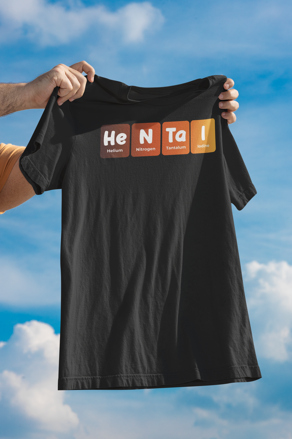 'Hentai' periodic table t-shirt in black, held up against a blue sky, funny geeky anime gift for otaku