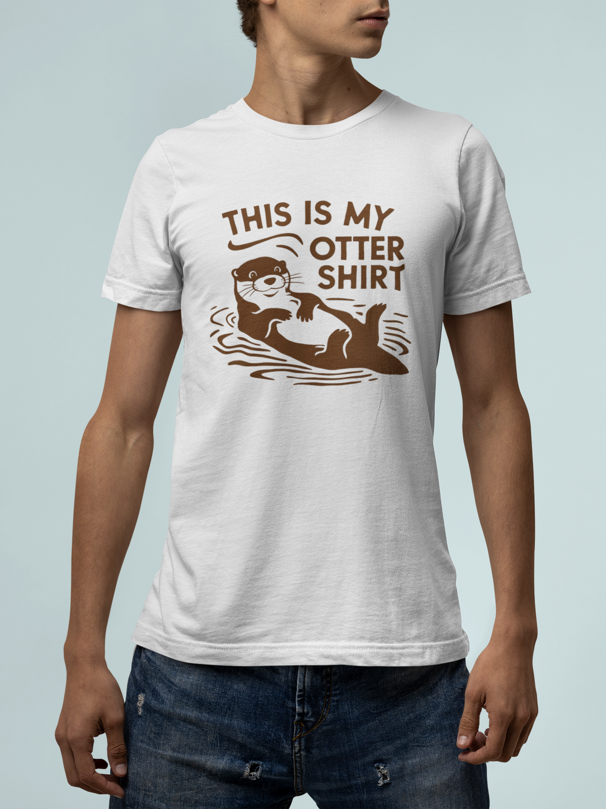 'This Is My Otter Shirt' t-shirt in white, man wearing it on a light teal background, funny gift idea