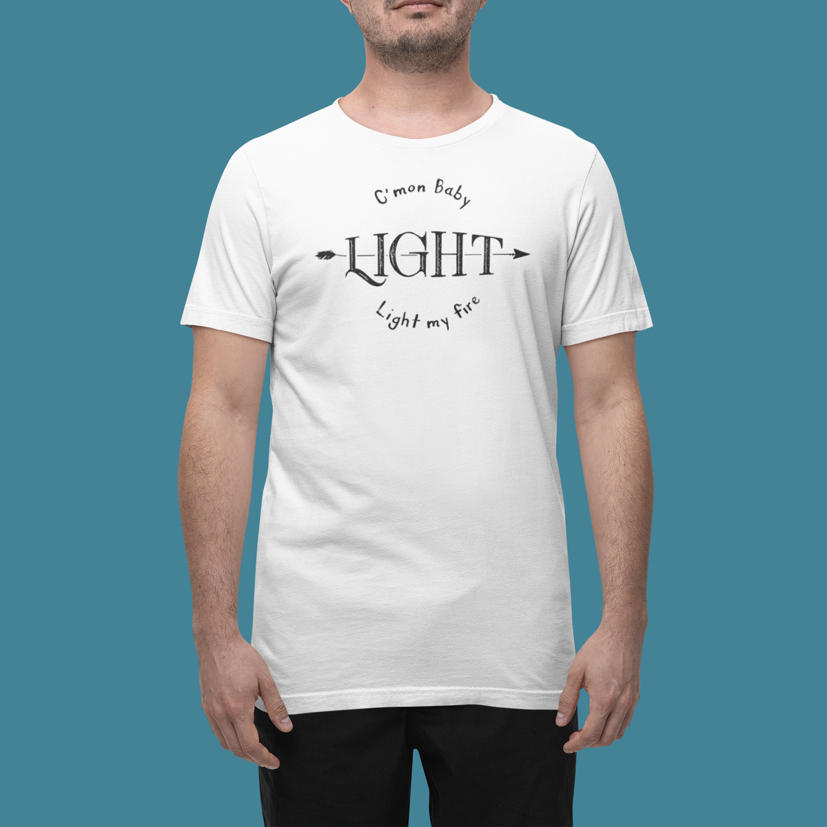 'Light My Fire' t-shirt in white, man wearing it in a studio, T-Shirt mockup, Geekpsters