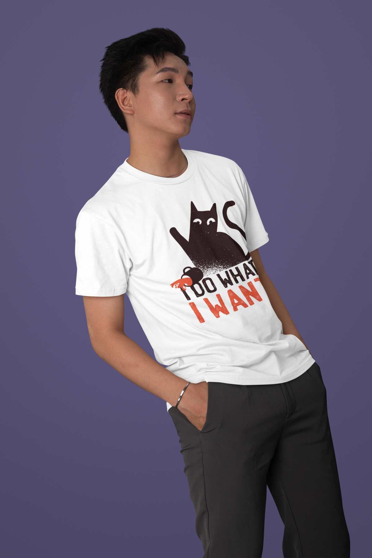 'I Do What I Want' cat T-shirt in white, man wearing it against a purple backdrop, funny cat lover shirt